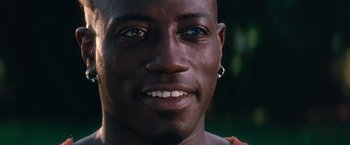 Movie still from “Demolition Man” (1993), directed by Marco Brambilla – A man's face with blue eyes; Close Up shot, High angle