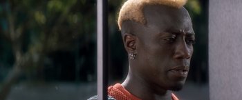 Movie still from “Demolition Man” (1993), directed by Marco Brambilla – A person with a shaved head; Close Up shot, High angle