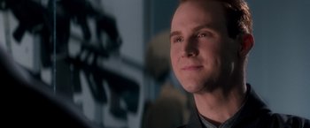 Movie still from “Demolition Man” (1993), directed by Marco Brambilla – A person looking up at the sky; Close Up shot, Over the shoulder angle