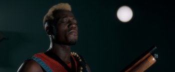 Movie still from “Demolition Man” (1993), directed by Marco Brambilla – A man with his eyes closed with his eyes closed; Close Up shot, Low angle