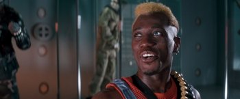 Movie still from “Demolition Man” (1993), directed by Marco Brambilla – A person wearing a helmet; Close Up shot, Low angle