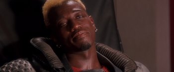 Movie still from “Demolition Man” (1993), directed by Marco Brambilla – A person wearing a helmet; Close Up shot, High angle