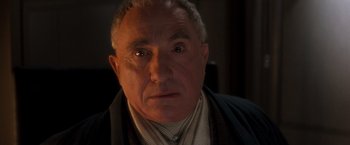 Movie still from “Demolition Man” (1993), directed by Marco Brambilla – An older man with a surprised look on his face; Close Up shot, High angle