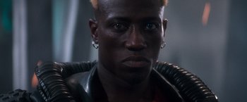 Movie still from “Demolition Man” (1993), directed by Marco Brambilla – A person wearing a leather jacket; Close Up shot, High angle