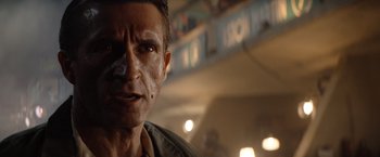 Movie still from “Ford v Ferrari” (2019), directed by James Mangold – A person wearing a shirt; Close Up shot, Low angle