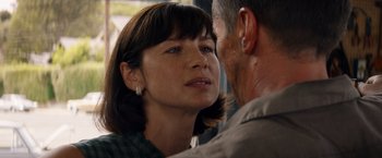 Movie still from “Ford v Ferrari” (2019), directed by James Mangold – A person with their face close to the face of another person; Close Up shot, Over the shoulder angle