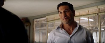 Movie still from “Ford v Ferrari” (2019), directed by James Mangold – A person wearing a white shirt; Close Up shot, Over the shoulder angle