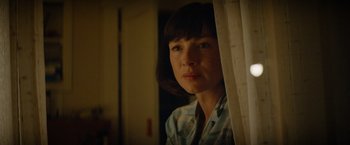 Movie still from “Ford v Ferrari” (2019), directed by James Mangold – A woman standing in front of a window; Close Up shot, Low angle