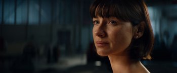 Movie still from “Ford v Ferrari” (2019), directed by James Mangold – A woman's face in a dark room; Close Up shot, Over the shoulder angle