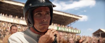 Movie still from “Ford v Ferrari” (2019), directed by James Mangold – A person wearing a helmet; Close Up shot, Over the shoulder angle