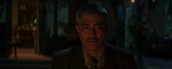 A person wearing a suit and tie