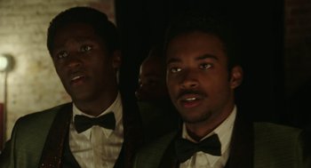Movie still from “Detroit” (2017), directed by Kathryn Bigelow – A couple of men standing next to each other in a room; Close Up shot, Low angle