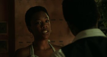 Movie still from “Detroit” (2017), directed by Kathryn Bigelow – A woman talking to a man in front of a brick wall; Close Up shot, Over the shoulder angle