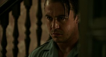 Movie still from “Detroit” (2017), directed by Kathryn Bigelow – A person wearing a green shirt; Close Up shot, Low angle