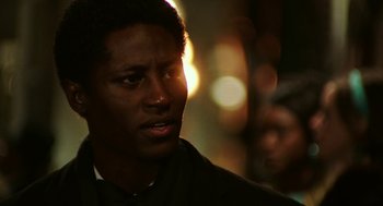 Movie still from “Detroit” (2017), directed by Kathryn Bigelow – A person holding a cell phone; Close Up shot, Over the shoulder angle