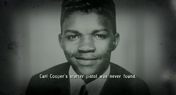 Movie still from “Detroit” (2017), directed by Kathryn Bigelow – An old black and white photo of a man with a quote; Extreme Close Up shot, High angle