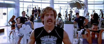 Movie still from “Dodgeball: A True Underdog Story” (2004), directed by Rawson Marshall Thurber – A man that has a mustache on his head; Close Up shot, High angle