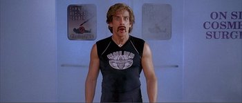 Movie still from “Dodgeball: A True Underdog Story” (2004), directed by Rawson Marshall Thurber – A man that is wearing a black t - shirt; Medium shot, Low angle