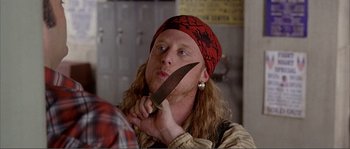 Movie still from “Dodgeball: A True Underdog Story” (2004), directed by Rawson Marshall Thurber – A man holding a knife in front of his face; Close Up shot, Over the shoulder angle