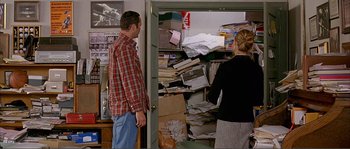 Movie still from “Dodgeball: A True Underdog Story” (2004), directed by Rawson Marshall Thurber – A man and a woman looking in a cluttered closet; Medium shot, High angle
