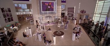 Movie still from “Dodgeball: A True Underdog Story” (2004), directed by Rawson Marshall Thurber – A gym filled with lots of people in front of a large screen; Extreme Wide shot, High angle