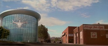 Movie still from “Dodgeball: A True Underdog Story” (2004), directed by Rawson Marshall Thurber – A street scene with a building in the background; Extreme Wide shot, Low angle