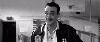 Movie still from “Dodgeball: A True Underdog Story” (2004), directed by Rawson Marshall Thurber – A black and white photo of a man smiling; Close Up shot, Low angle