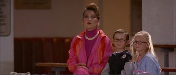 Movie still from “Dodgeball: A True Underdog Story” (2004), directed by Rawson Marshall Thurber – A woman and a boy sitting on a bench; Medium shot, Over the shoulder angle