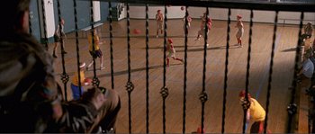 Movie still from “Dodgeball: A True Underdog Story” (2004), directed by Rawson Marshall Thurber – A group of young men playing a game of baseball; Wide shot, High angle