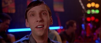 Movie still from “Dodgeball: A True Underdog Story” (2004), directed by Rawson Marshall Thurber – A person with a person in the background; Close Up shot, Low angle