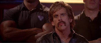 Movie still from “Dodgeball: A True Underdog Story” (2004), directed by Rawson Marshall Thurber – A person with a beard and a mustache; Close Up shot, Low angle