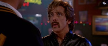 Movie still from “Dodgeball: A True Underdog Story” (2004), directed by Rawson Marshall Thurber – A person with a mustache; Close Up shot, Over the shoulder angle