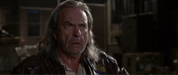 Movie still from “Dodgeball: A True Underdog Story” (2004), directed by Rawson Marshall Thurber – An older man with long hair and a beard; Close Up shot, Over the shoulder angle