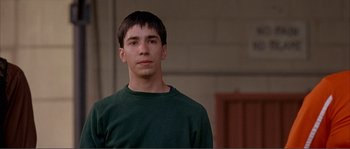 Movie still from “Dodgeball: A True Underdog Story” (2004), directed by Rawson Marshall Thurber – A man in a green shirt is looking at the camera; Close Up shot, Over the shoulder angle