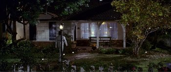 Movie still from “Dodgeball: A True Underdog Story” (2004), directed by Rawson Marshall Thurber – A person standing in front of a house at night; Extreme Wide shot, High angle