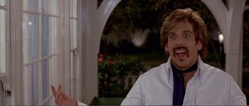 Movie still from “Dodgeball: A True Underdog Story” (2004), directed by Rawson Marshall Thurber – A man in a white lab coat and a purple tie; Close Up shot, Over the shoulder angle