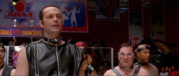 Movie still from “Dodgeball: A True Underdog Story” (2004), directed by Rawson Marshall Thurber – A man and a woman in leather clothes and chains in a room; Close Up shot, Low angle