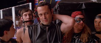 Movie still from “Dodgeball: A True Underdog Story” (2004), directed by Rawson Marshall Thurber – A man in a black leather jacket with a black collar; Close Up shot, Low angle