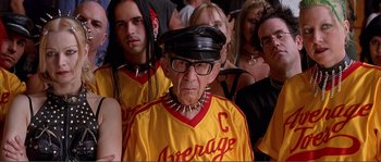 Movie still from “Dodgeball: A True Underdog Story” (2004), directed by Rawson Marshall Thurber – An old man wearing a baseball cap and a jersey; Close Up shot, Low angle