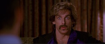 Movie still from “Dodgeball: A True Underdog Story” (2004), directed by Rawson Marshall Thurber – A person with a beard and a mustache; Close Up shot, Over the shoulder angle