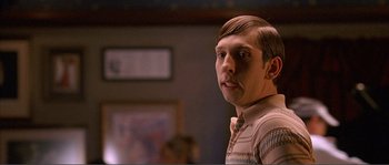 Movie still from “Dodgeball: A True Underdog Story” (2004), directed by Rawson Marshall Thurber – A young man with a shaved head and a mustache; Close Up shot, Over the shoulder angle