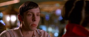 Movie still from “Dodgeball: A True Underdog Story” (2004), directed by Rawson Marshall Thurber – A person wearing a pink shirt; Close Up shot, Low angle