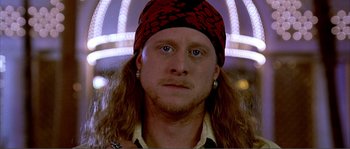 Movie still from “Dodgeball: A True Underdog Story” (2004), directed by Rawson Marshall Thurber – A person with long hair wearing a hat; Close Up shot, Low angle