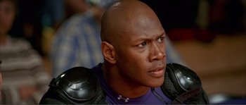 Movie still from “Dodgeball: A True Underdog Story” (2004), directed by Rawson Marshall Thurber – A person with a helmet on; Close Up shot, Low angle