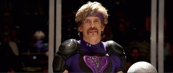Movie still from “Dodgeball: A True Underdog Story” (2004), directed by Rawson Marshall Thurber – A man in a purple costume with a helmet on; Close Up shot, Low angle