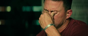 Movie still from “Dog” (2022), directed by Reid Carolin – A person holding his hands to his face; Extreme Close Up shot, Low angle