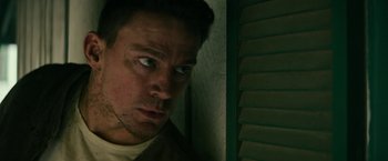 Movie still from “Dog” (2022), directed by Reid Carolin – A person looking at the camera; Close Up shot, Low angle