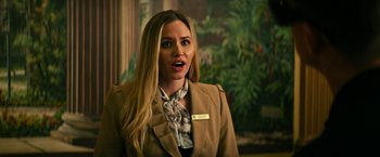 Movie still from “Dog” (2022), directed by Reid Carolin – A woman in a brown jacket is talking to someone; Close Up shot, Over the shoulder angle