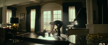 Movie still from “Dog” (2022), directed by Reid Carolin – A man and a dog in a living room; Wide shot, Low angle