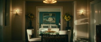 Movie still from “Dog” (2022), directed by Reid Carolin – A room with a bed , a couch , a table , and two chairs; Wide shot, Low angle